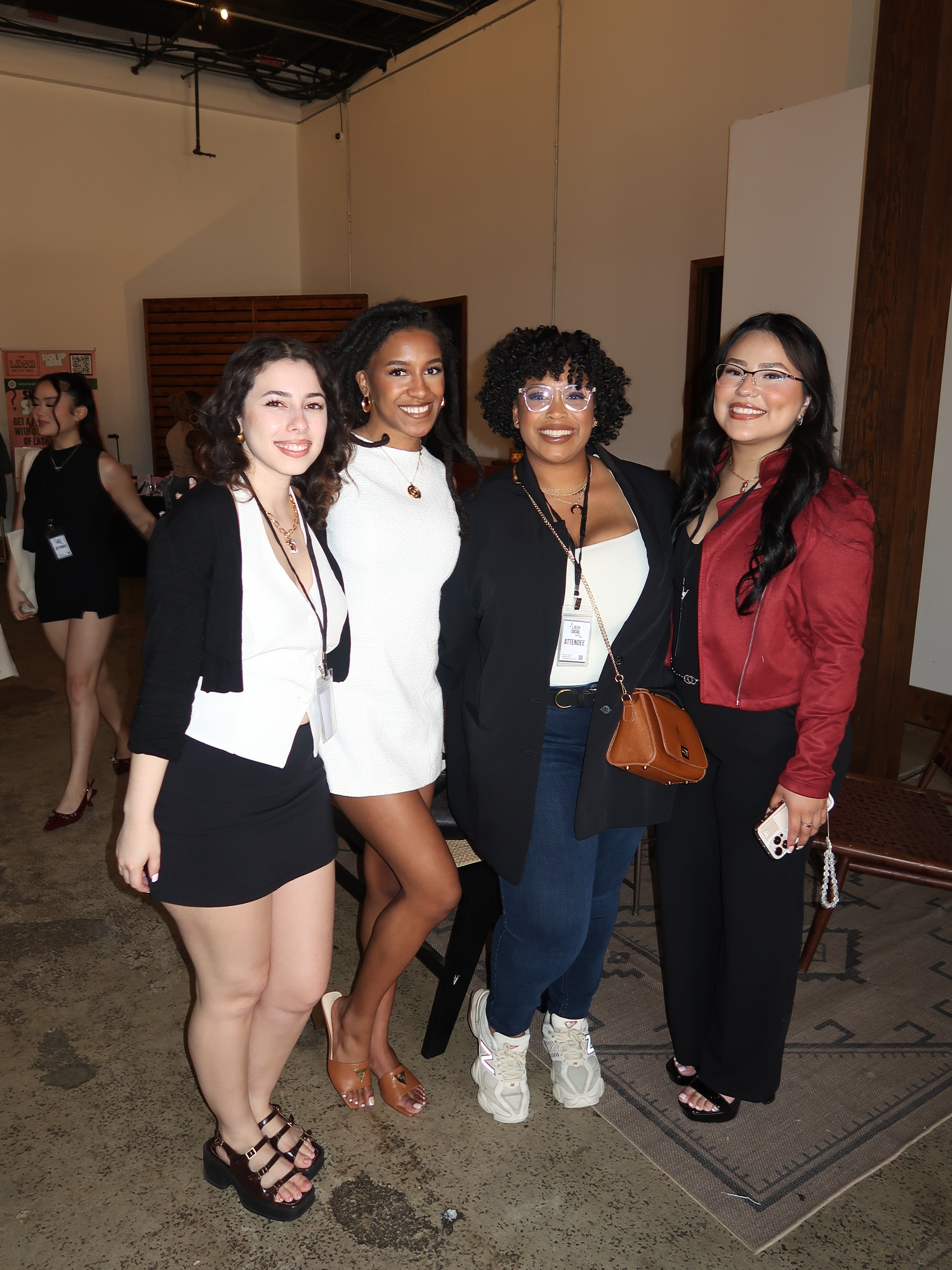 Four women posing together in a room at a lash convention. Lash Social Convention Atlanta, Georgia